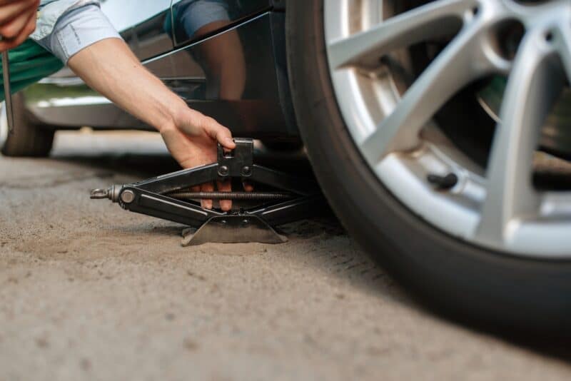 Car Breakdown, Male Person Repairing Flat Tyre